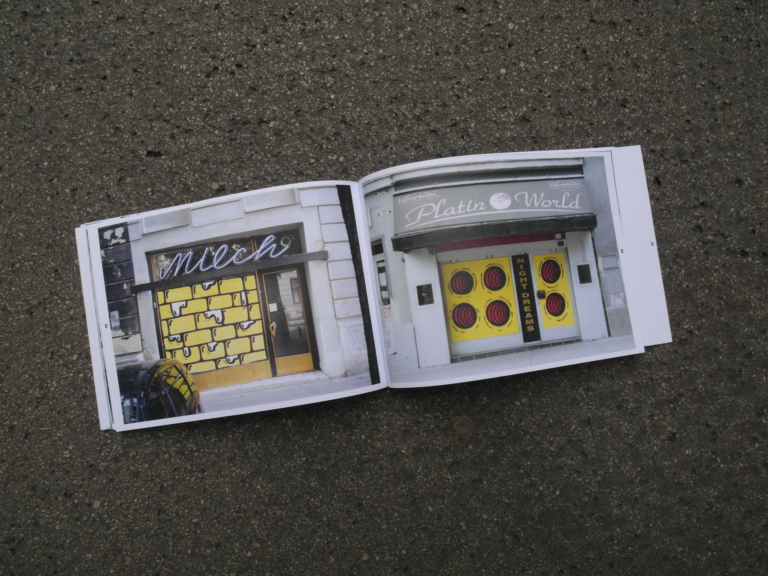 Open book lying on the street. 2 photos of old abandoned business premises. Windows planked with chipboard. Motifs painted on them in yellow/black.